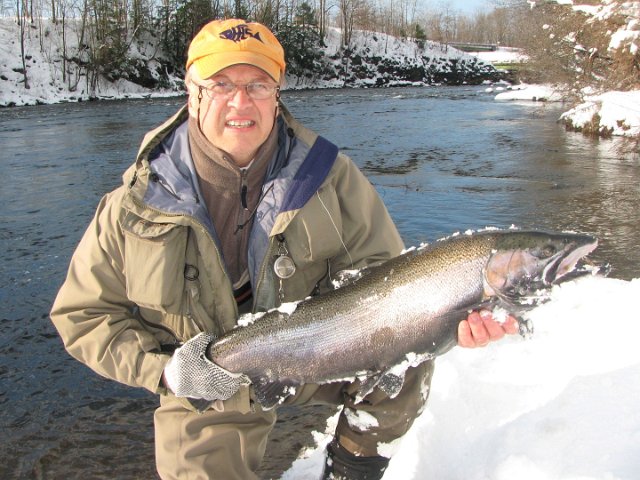 Gary Christie - Salmon River.JPG - This fish, jumped 6 times clearing 4-5 ft twice and ran countless times.It took 20 minutes to bring in and extra effort stop it from exiting a tail out to a rapids with a 30ft drop.I took up religion very quickly in an effort to receive all the help I could get from the good Lord and land this one!!Gary.